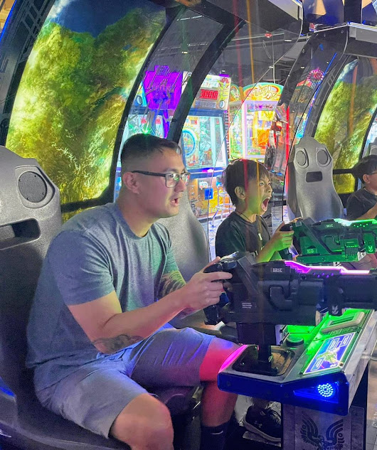 At the Arcade With Our Godson