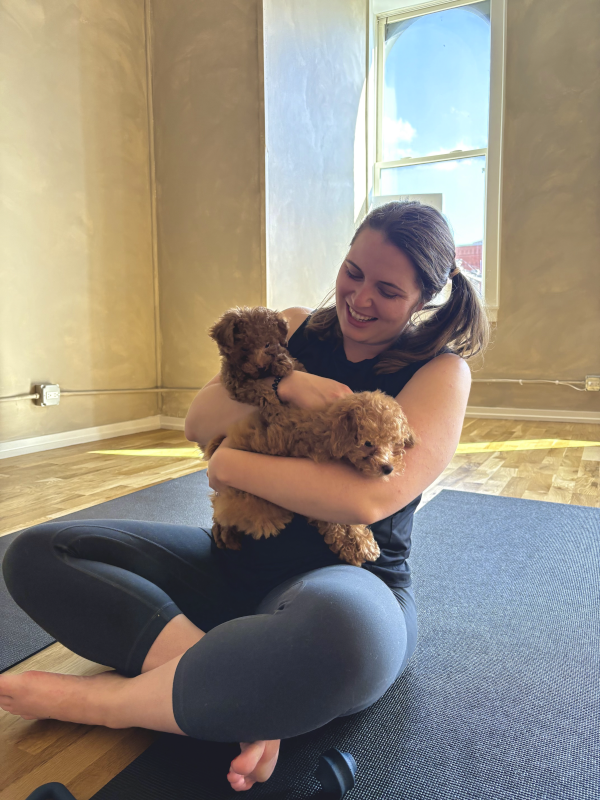 Enjoying Some Cuddles During Puppy Yoga