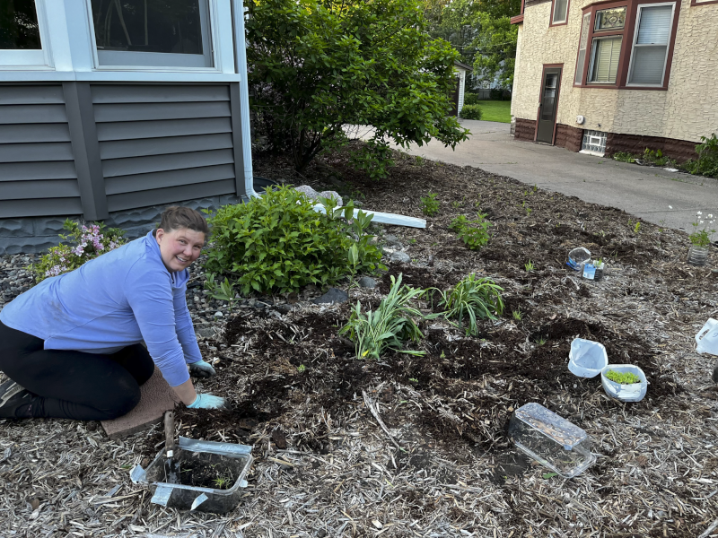 Krystal Planting the Prairie Garden in Our Front Yard